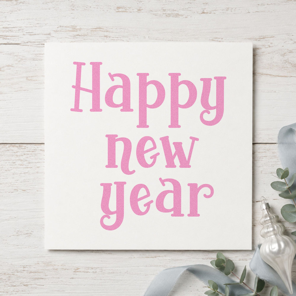 Happy New Year Serif craft stamp in purple ink on cardstock, an easy option for annual album page.