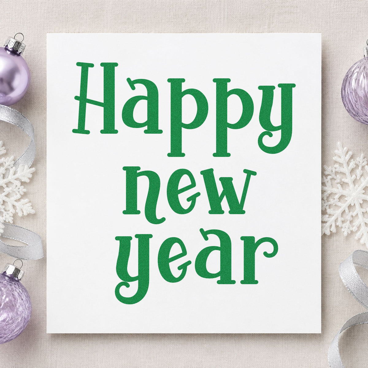 Happy New Year Serif craft stamp imprint in green ink on a handmade project, one idea being kickoff meeting cards.
