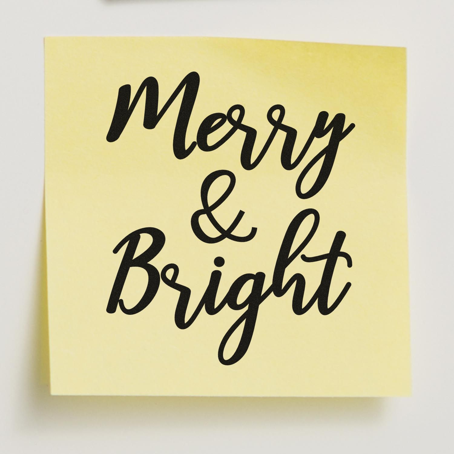 Merry & Bright holiday rubber stamp design in black script on yellow background for Christmas cards and craft projects.