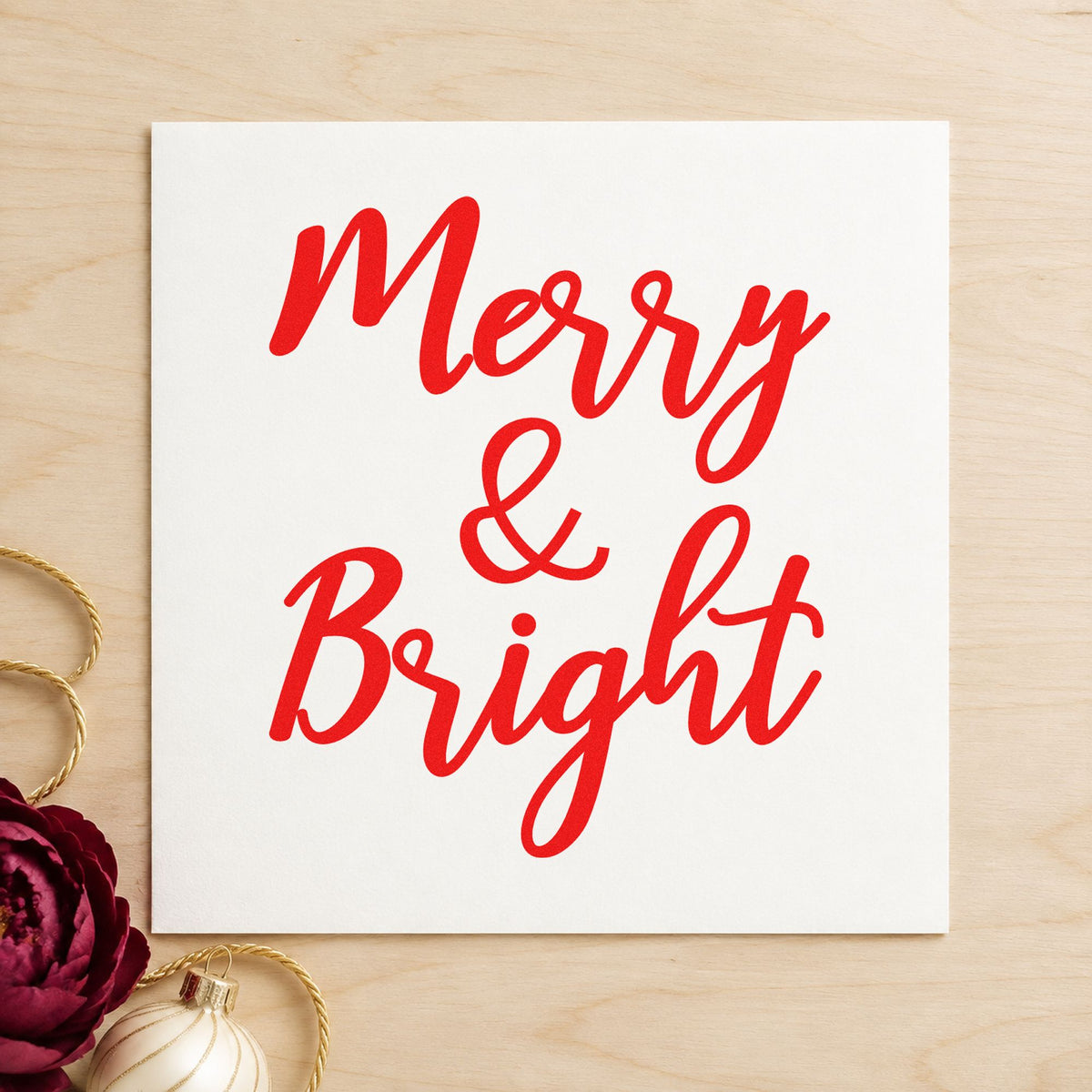 Merry And Bright Brush Script craft stamp in red ink on cardstock, an easy option for canvas drop printing.