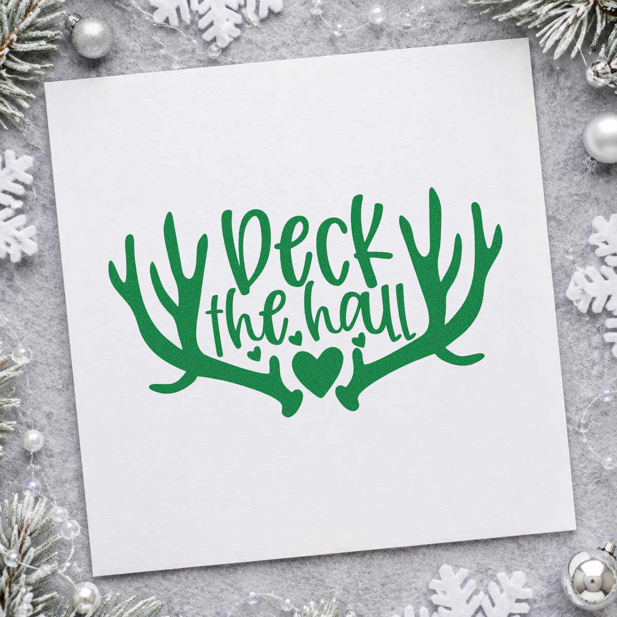 Deck The Hall Antlers craft stamp imprint in green ink on a handmade project, one idea being garland bundle tags.