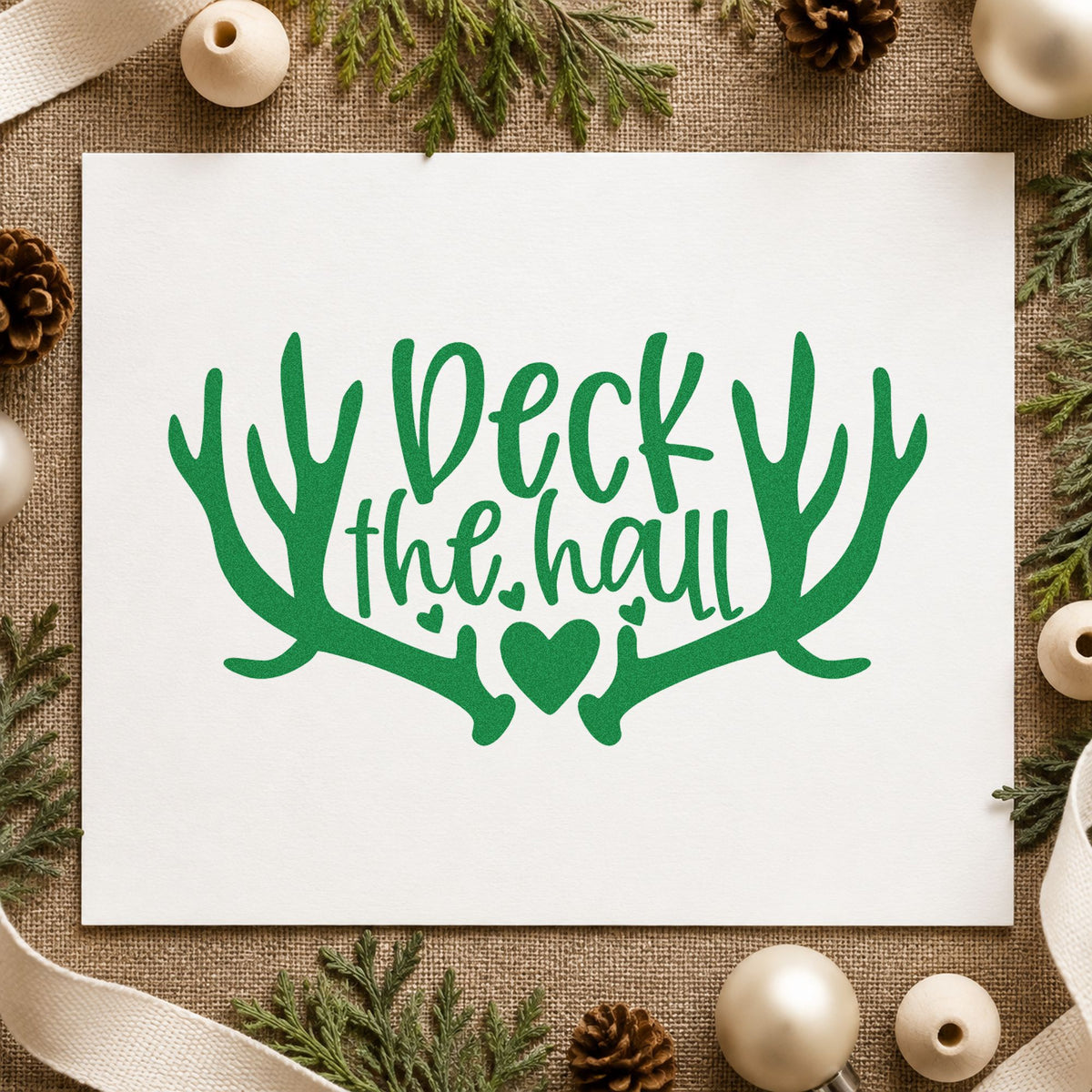 Deck The Hall Antlers craft stamp imprinted in green ink on paper, a design suited to framed entry mirror.