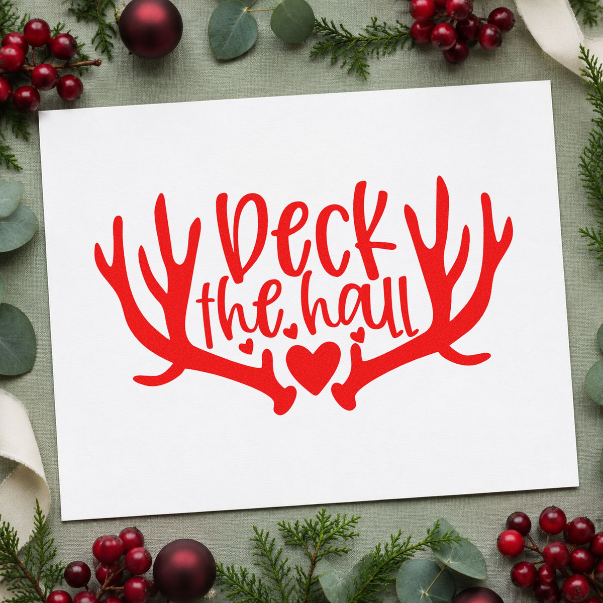 Deck The Hall Antlers rubber stamp shown in red ink, stamped for projects such as hook row labels.