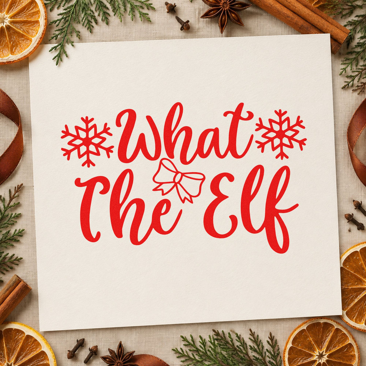 What The Elf Snowflakes craft stamp in red ink on cardstock, an easy option for oven mitt ink print.