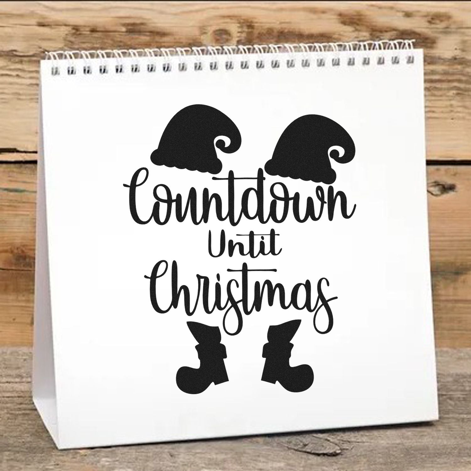 Christmas countdown rubber stamp design with Santa hat and boots for holiday gift bags and festive craft projects.
