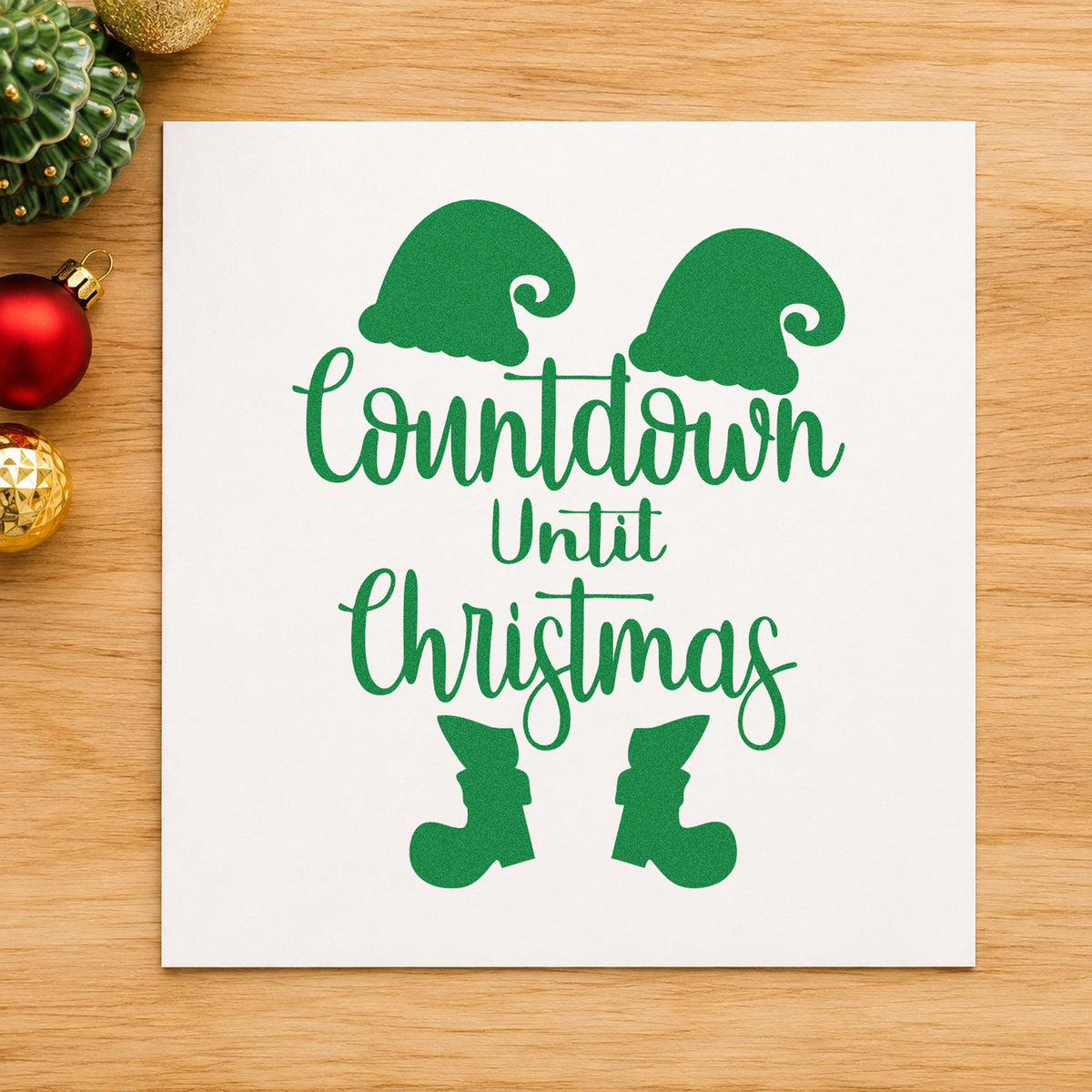 Countdown Until Christmas Elf craft stamp imprint in green ink on a handmade project, one idea being numbered day tags.