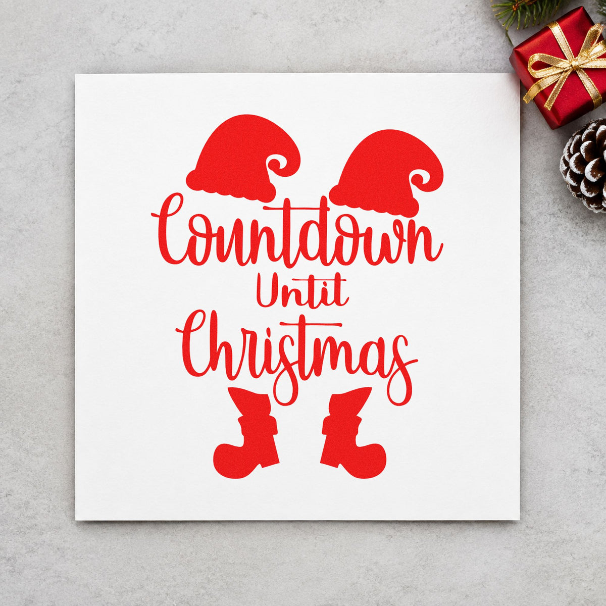 Countdown Until Christmas Elf rubber stamp shown in red ink, stamped for projects such as advent drawer labels.