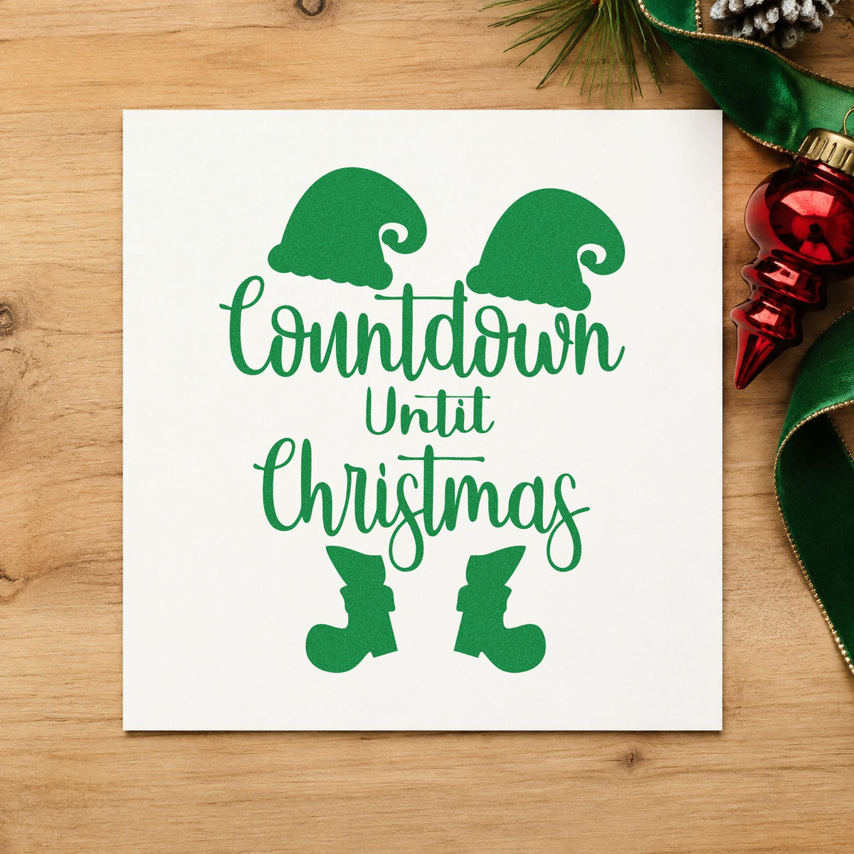 Countdown Until Christmas Elf craft stamp imprint in green ink on a handmade project, one idea being kickoff party cards.