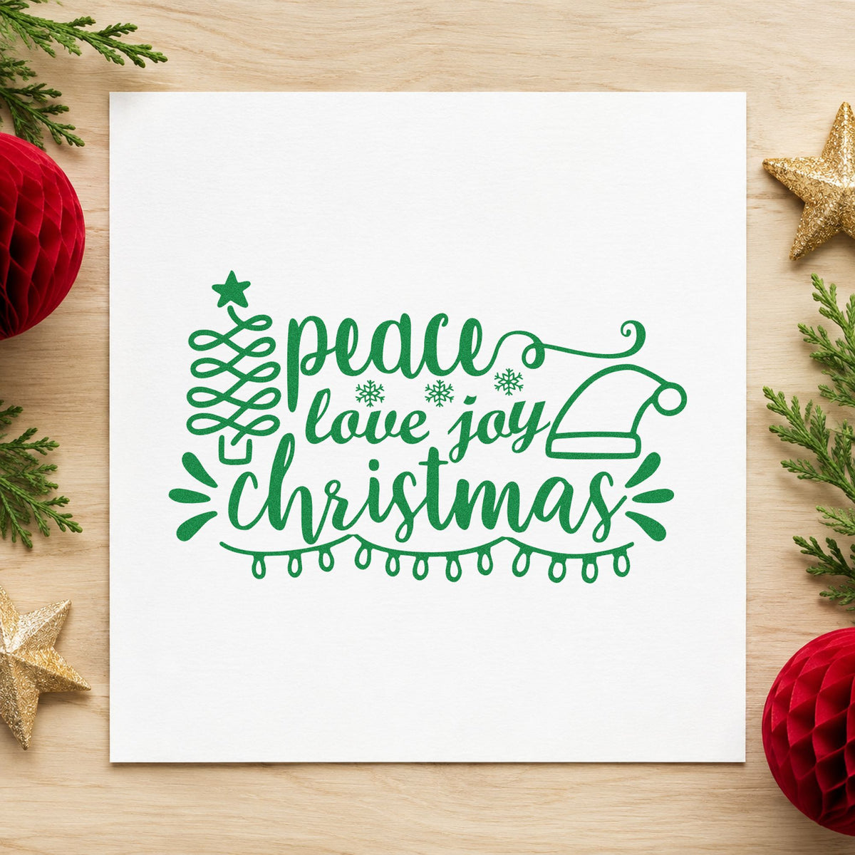 Peace Love Joy Christmas craft stamp imprint in green ink on a handmade project, one idea being bedroom door tags.