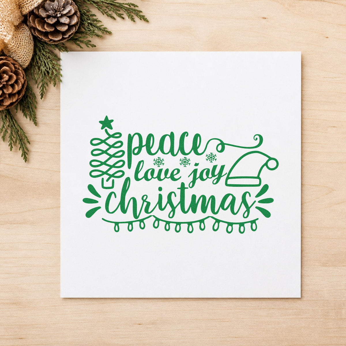 Peace Love Joy Christmas craft stamp imprint in green ink on a handmade project, one idea being sleepover night passes.