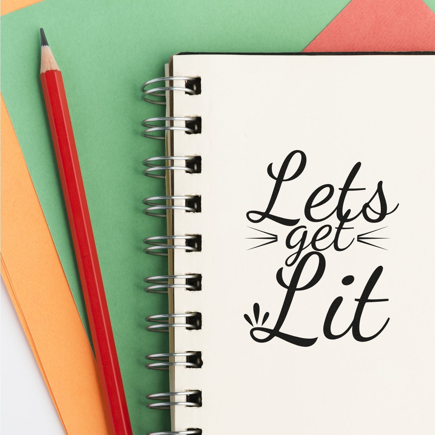 Custom rubber stamp design with Lets Get Lit script on notebook, perfect for stationery, planners, and craft projects.