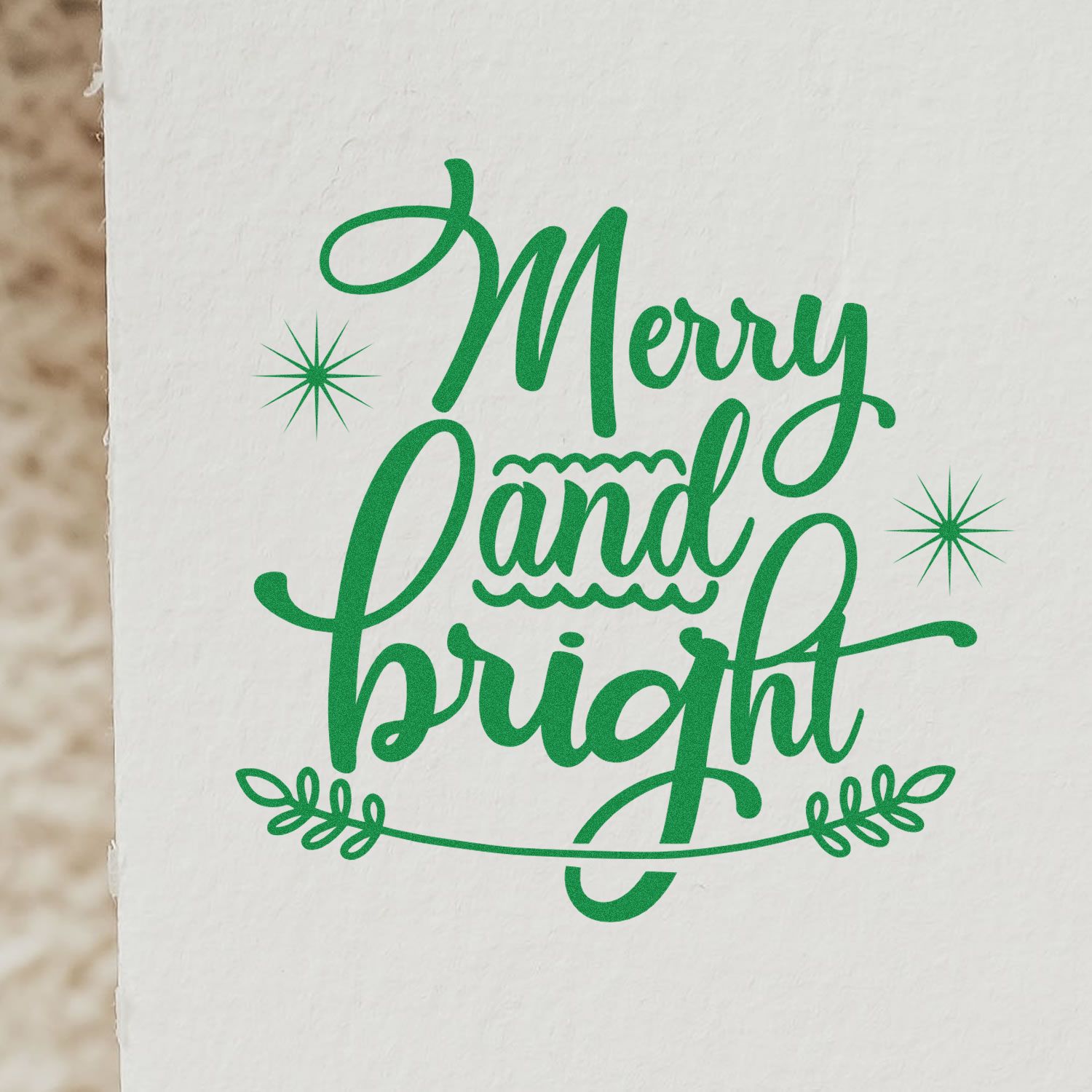 Merry and Bright festive holiday rubber stamp design in green script with stars and leaf accents.