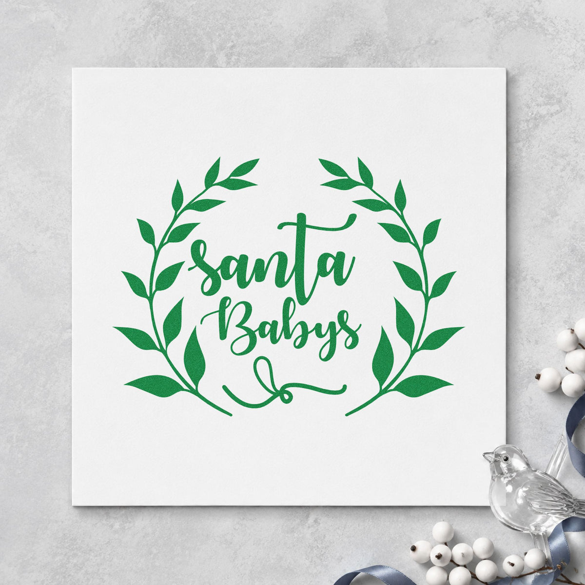 Santa Babys Leaf Wreath craft stamp imprint in green ink on a handmade project, one idea being jewelry box tags.