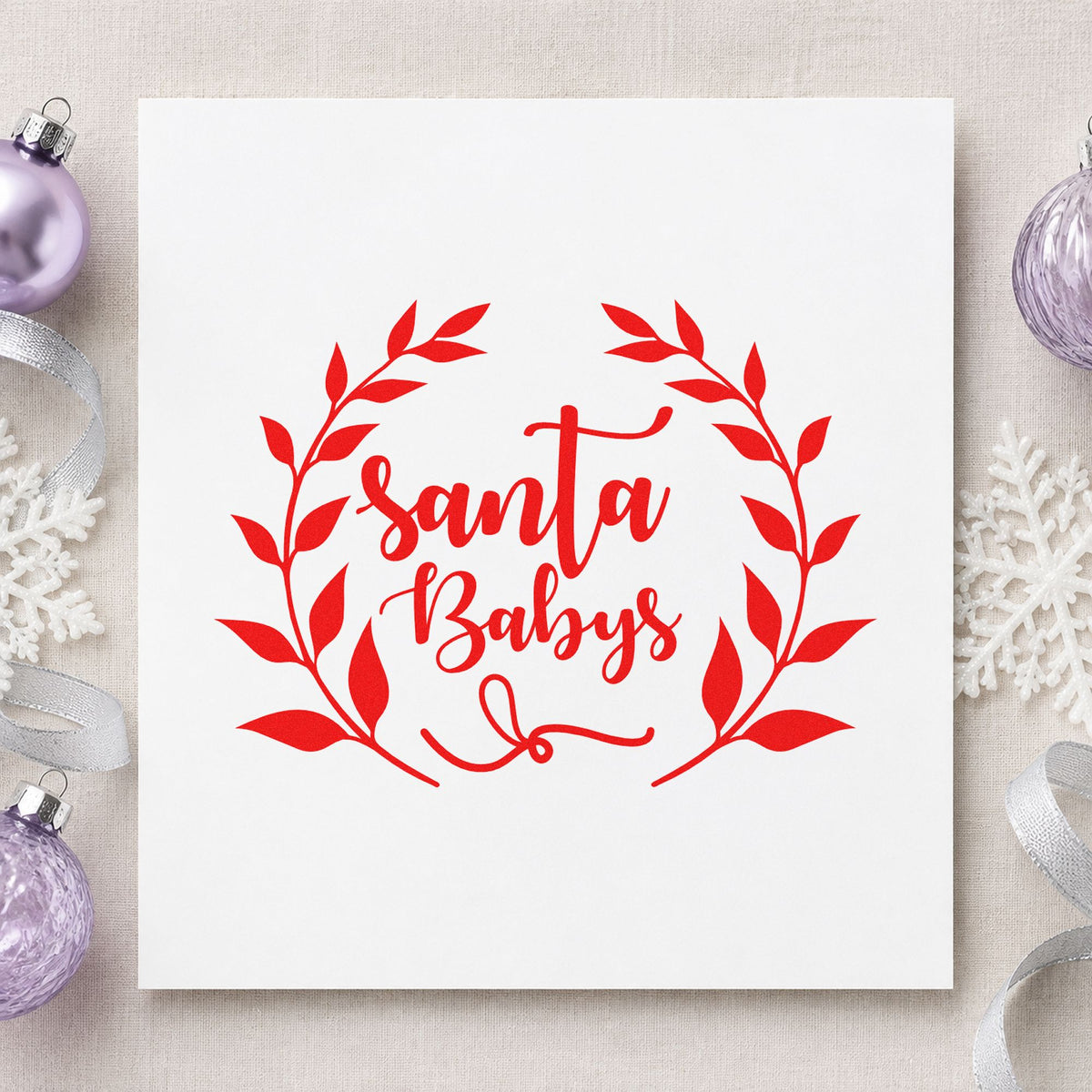 Santa Babys Leaf Wreath rubber stamp shown in red ink, stamped for projects such as perfume sleeve labels.