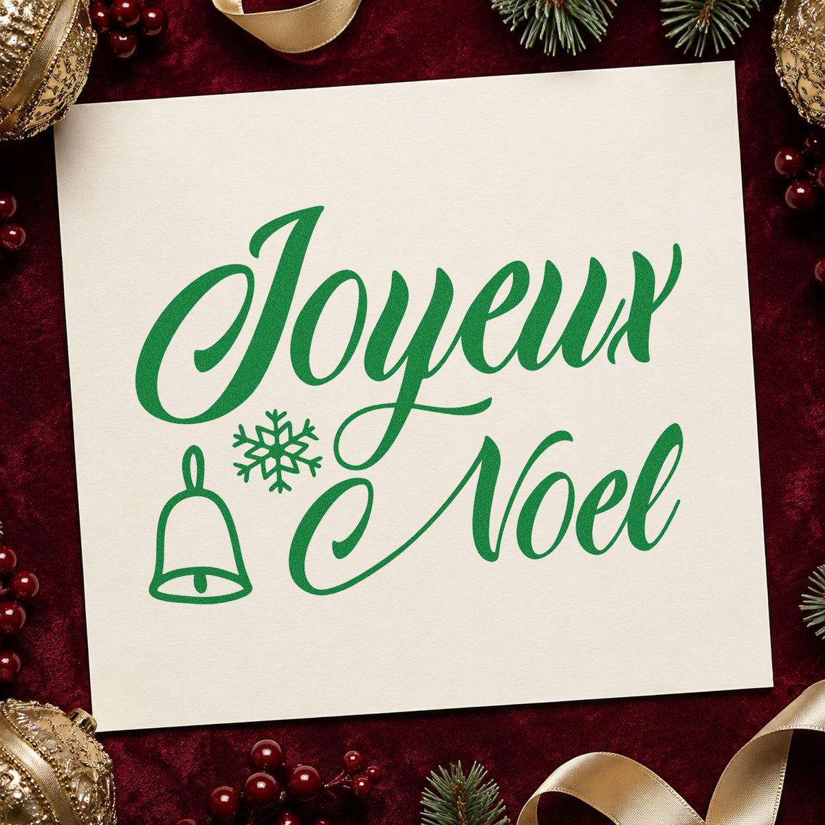 Joyeux Noel Bell Snowflake craft stamp imprint in green ink on a handmade project, one idea being reveillon dinner menus.