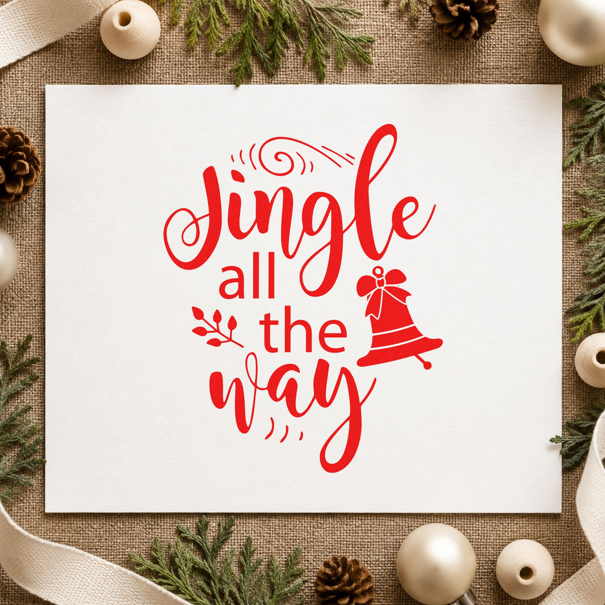 Jingle All The Way Bell craft stamp in red ink on cardstock, an easy option for ribbon face printing.