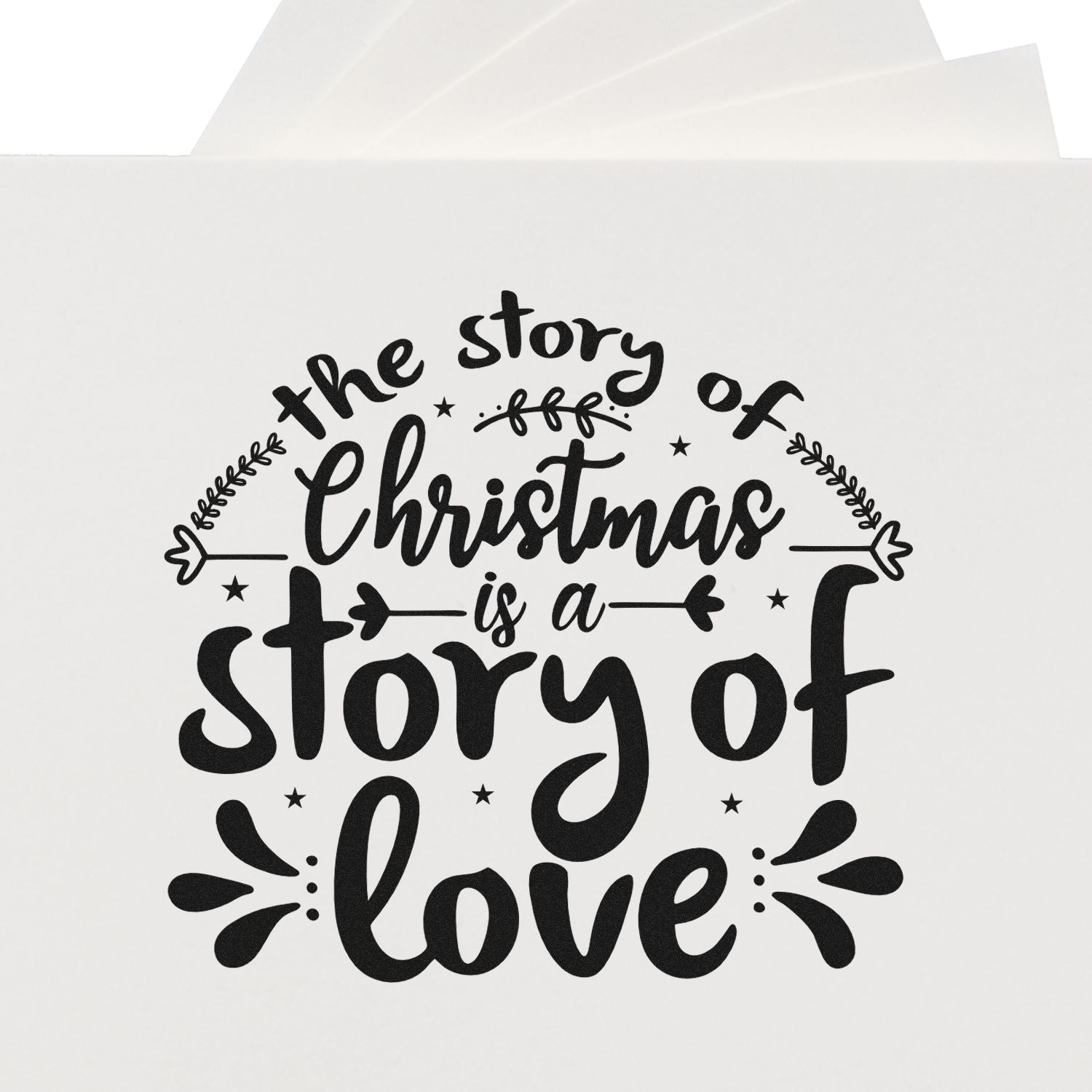 Christmas rubber stamp with The story of Christmas is a story of love in decorative script and stars on white paper.