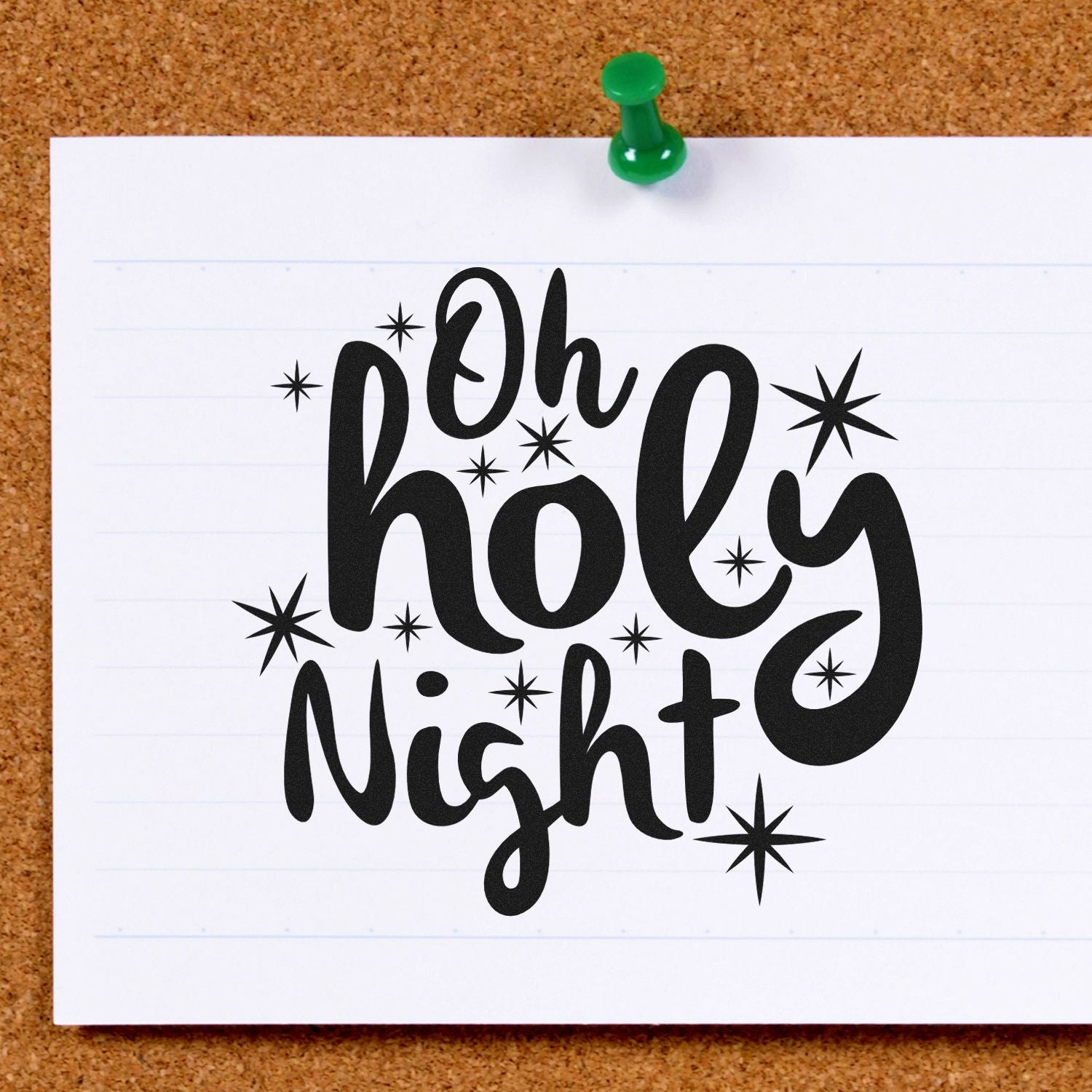 Oh Holy Night rubber stamp design with starburst accents, shown stamped on paper and pinned to a corkboard.