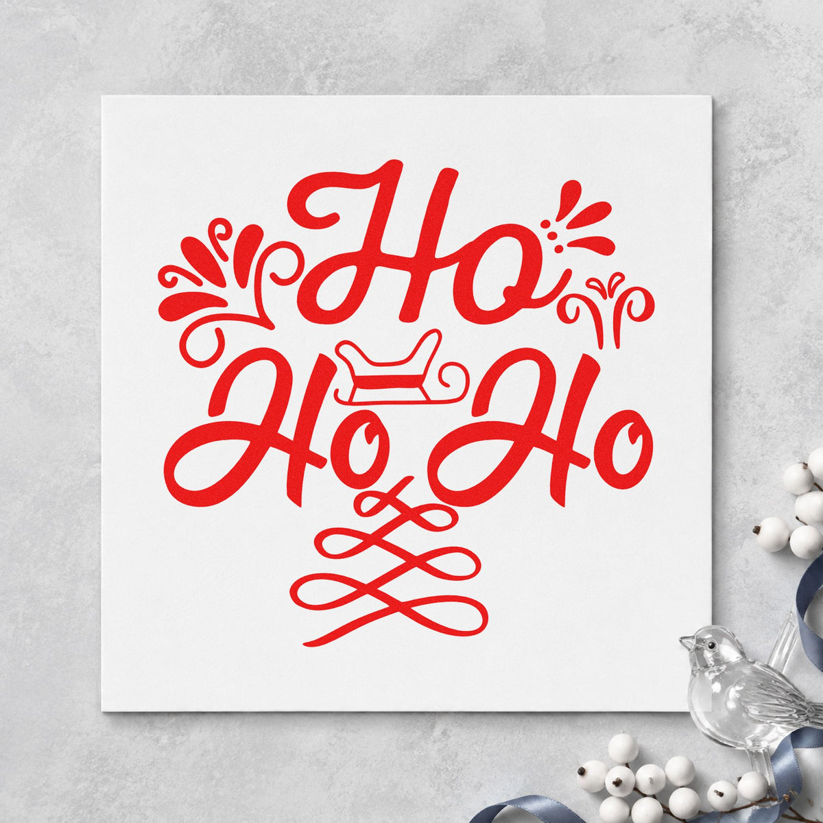 Ho Ho Ho Sleigh craft stamp in red ink on cardstock, an easy option for mantel cloth printing.