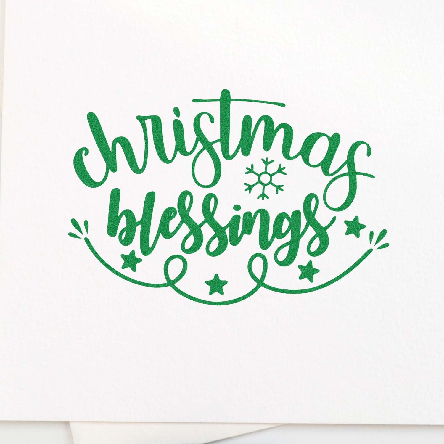 Christmas Blessings rubber stamp for holiday cards, featuring green script, snowflake, and stars.