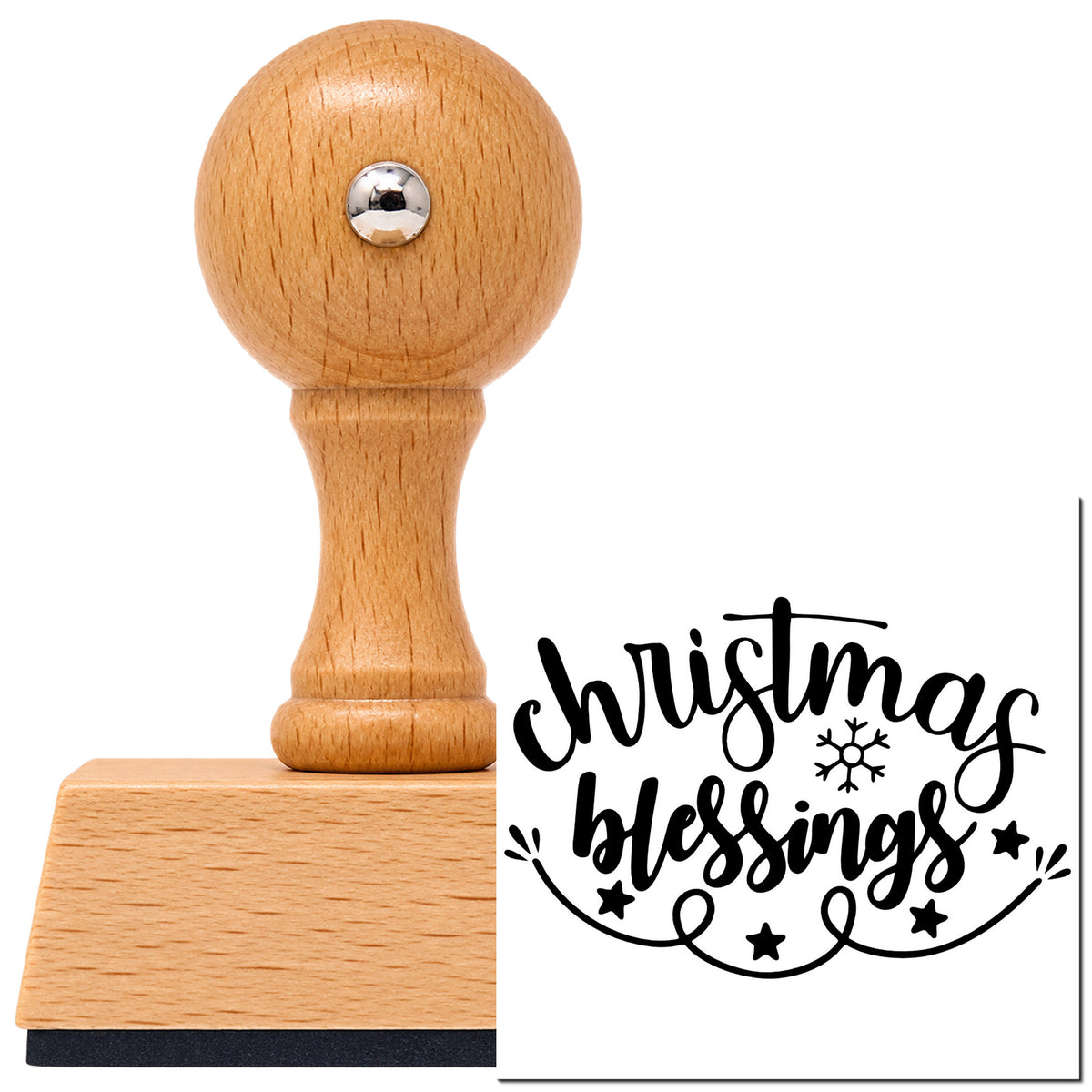 Christmas Blessings Snowflake Vintage Pro rubber stamp in European beech wood with a round knob handle, shown beside its black imprint.