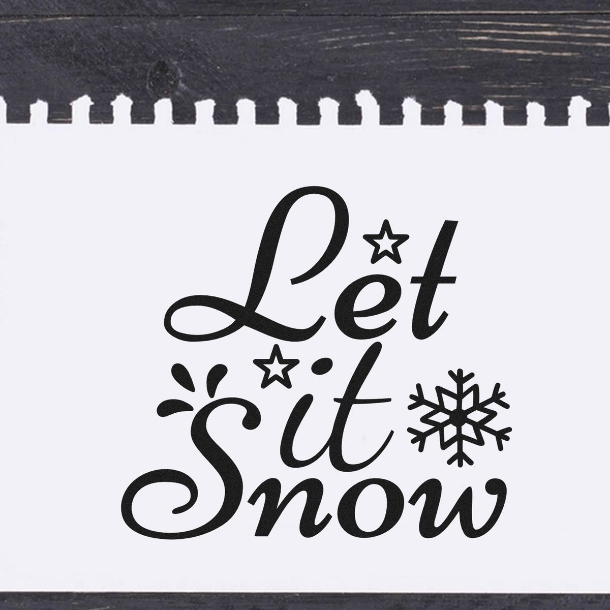 Premium Wooden Let It Snow Stamp - Vintage Pro imprint stamped in black ink. "Let It Snow" appears in flowing script with stars, a large snowflake, and accent strokes.
