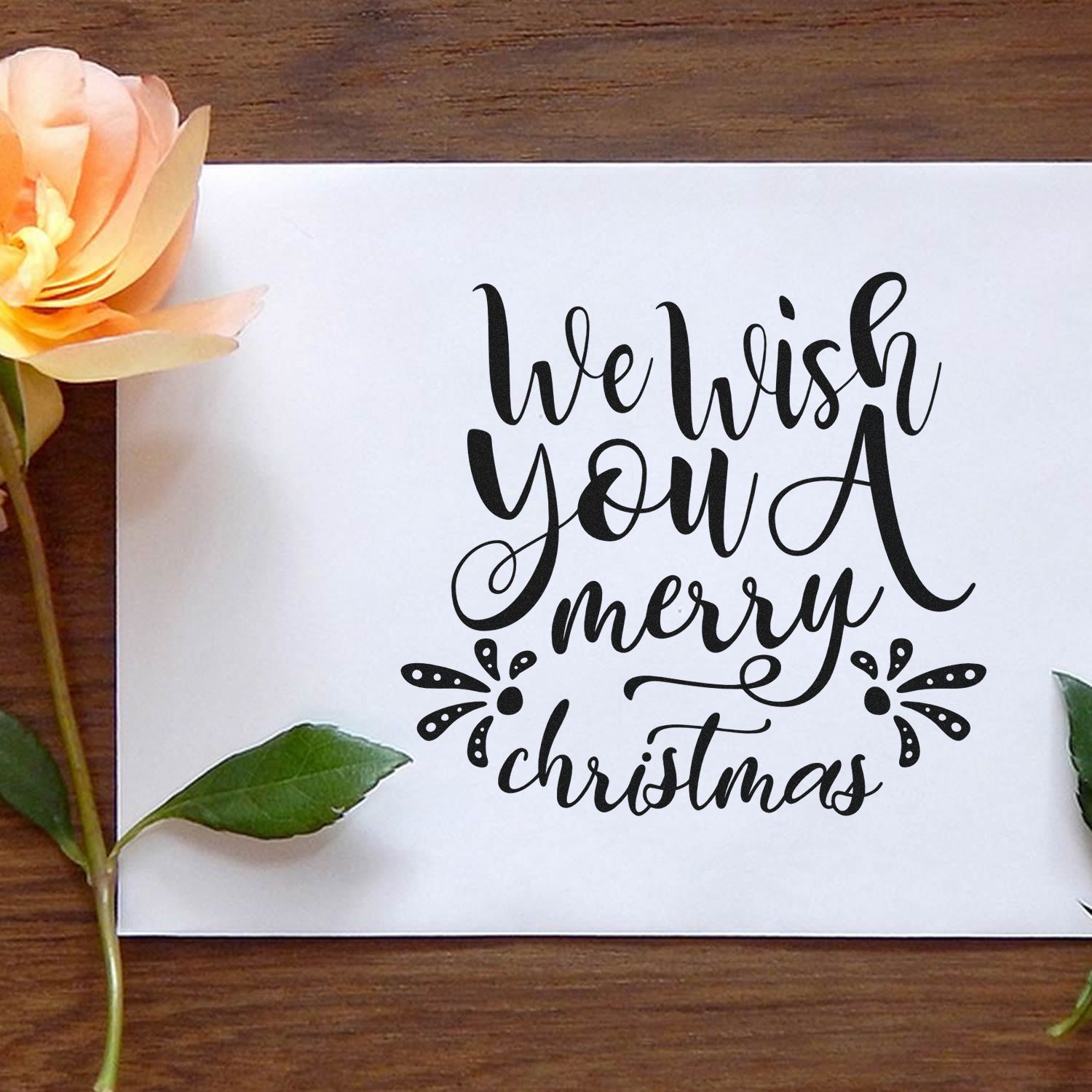 Hand-lettered We Wish You a Merry Christmas rubber stamp design for holiday cards, scrapbooking, and festive crafts.