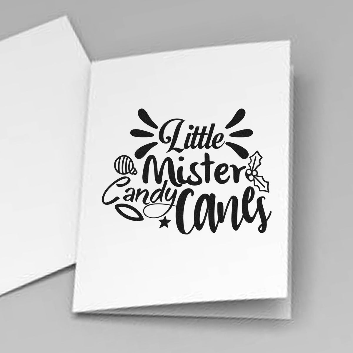 Little Mister Candy Canes Holly Premium Wood-Mounted Stamp - Vintage Pro imprint stamped in black ink. "Little Mister Candy Canes" is decorated with an ornament, holly, a star, and radiating strokes.