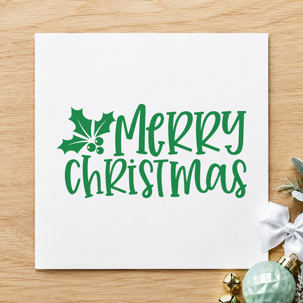 Merry Christmas Holly Corner craft stamp imprinted in green ink on paper, a design suited to framed off center.