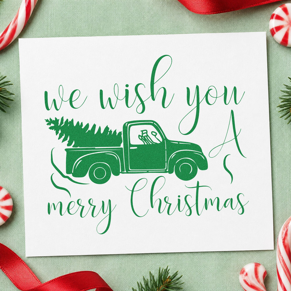 Wish You Christmas Pickup craft stamp imprinted in green ink on paper, a design suited to framed garage bay.
