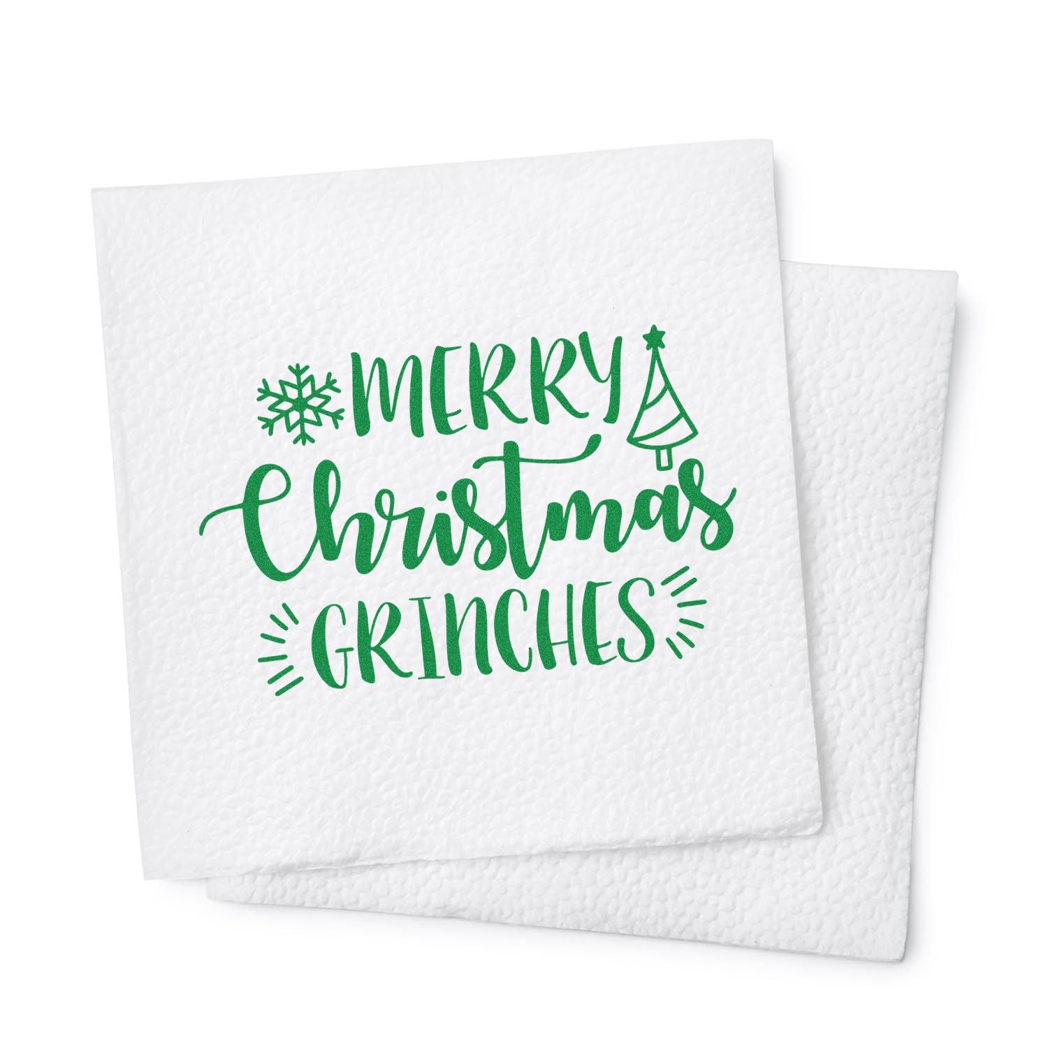 Merry Christmas Grinches holiday rubber stamp design with green lettering, snowflake, and Christmas tree for festive cards and napkins.