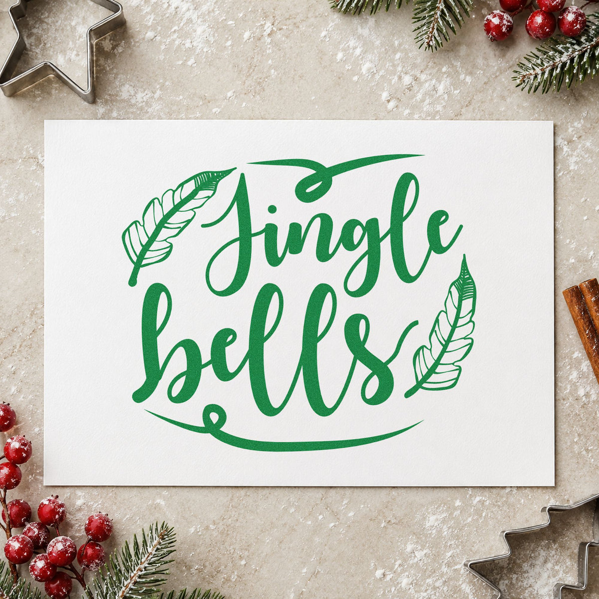 Jingle Bells Feather Flourishes craft stamp imprint in green ink on a handmade project, one idea being macrame gift tags.