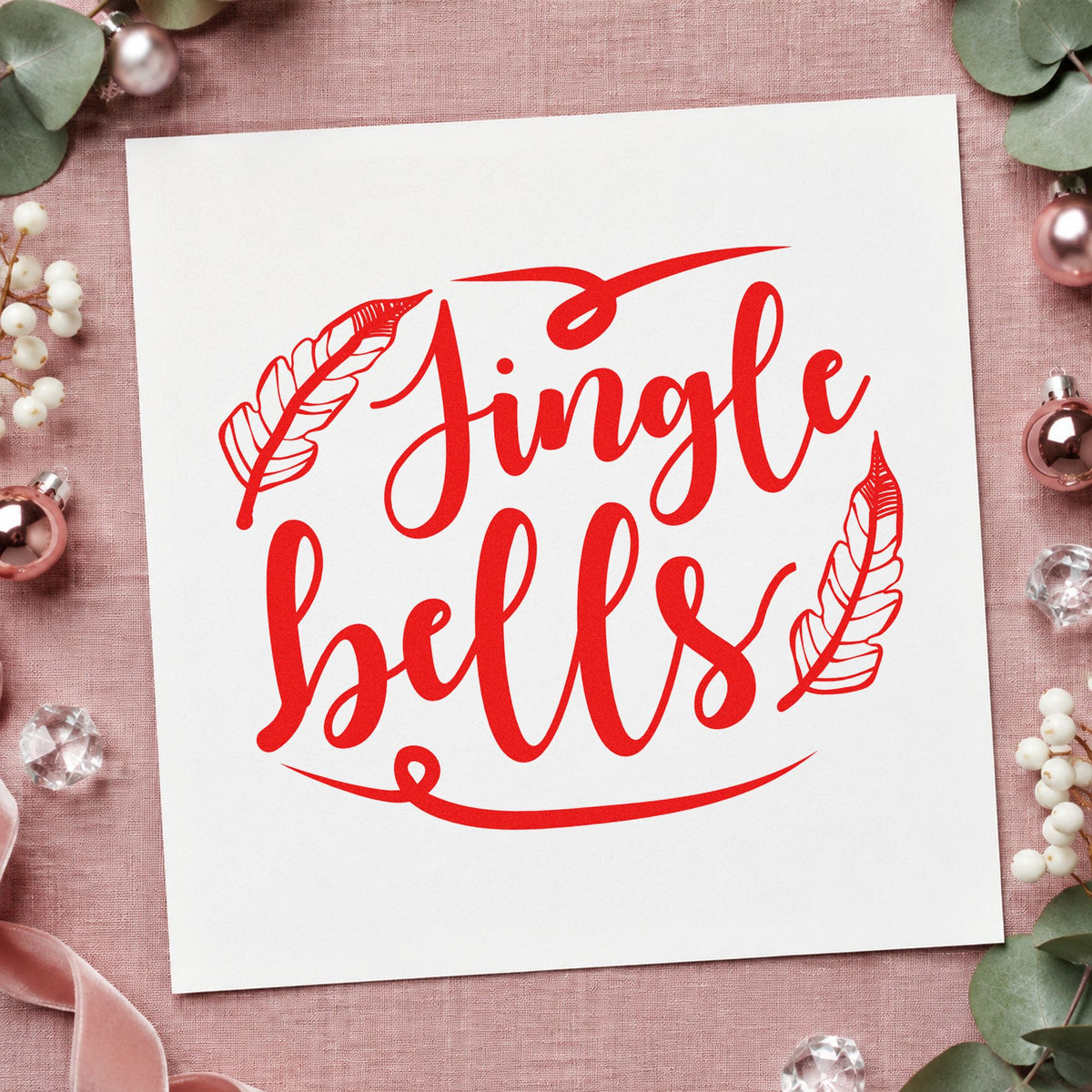 Jingle Bells Feather Flourishes craft stamp in red ink on cardstock, an easy option for wall weaving printing.