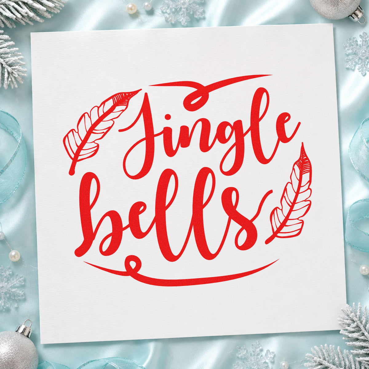 Jingle Bells Feather Flourishes rubber stamp shown in red ink, stamped for projects such as fiber basket labels.