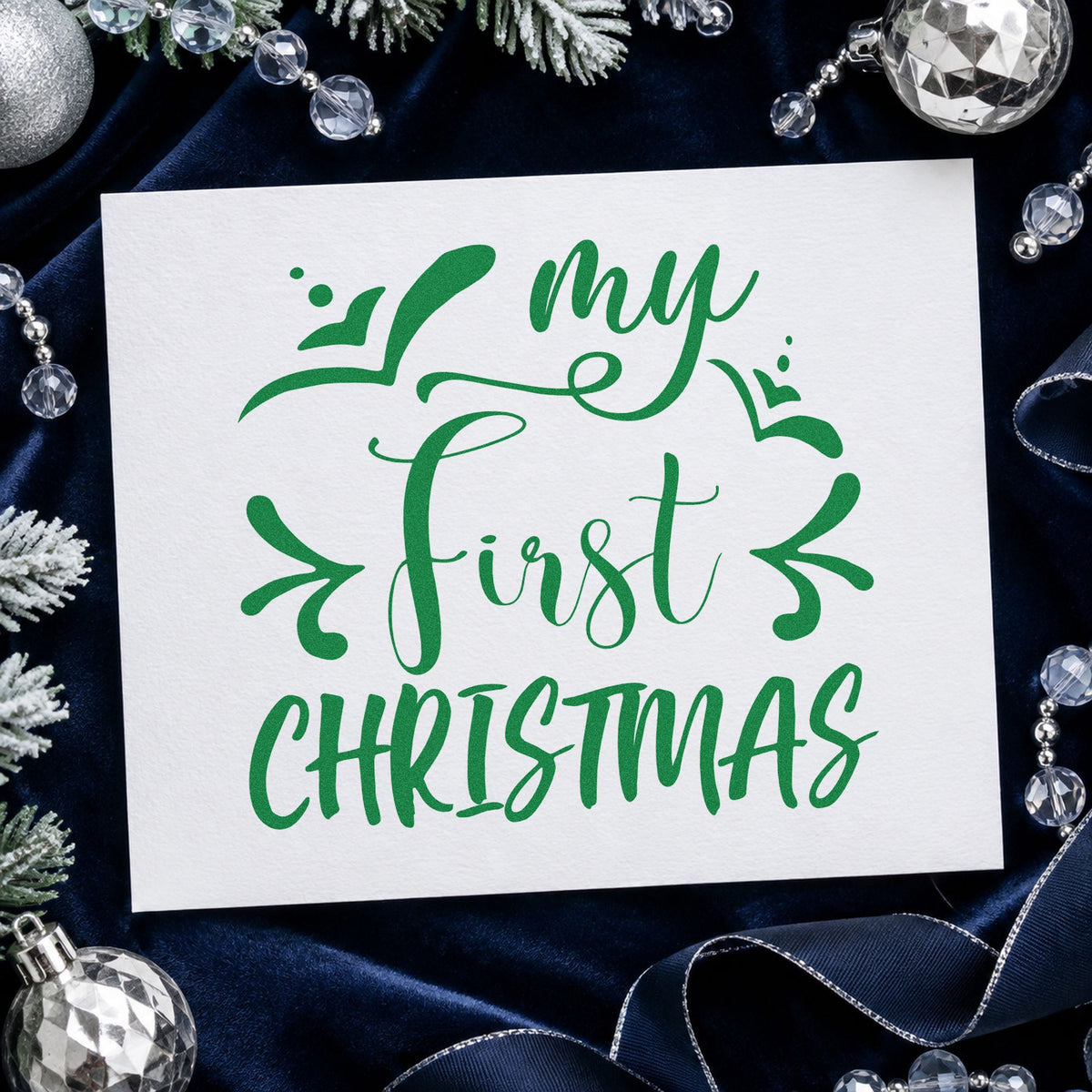 My First Christmas craft stamp imprint in green ink on a handmade project, one idea being naming day cards.