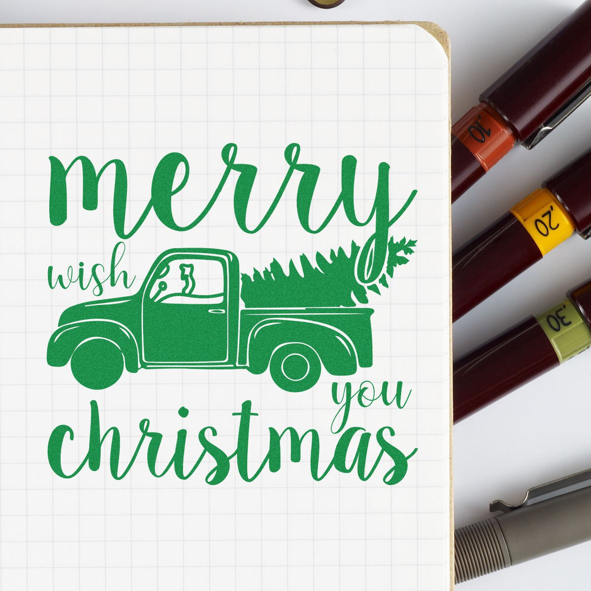 Merry Christmas Pickup Tree rubber stamp shown in green ink, stamped for projects such as delivery day album.