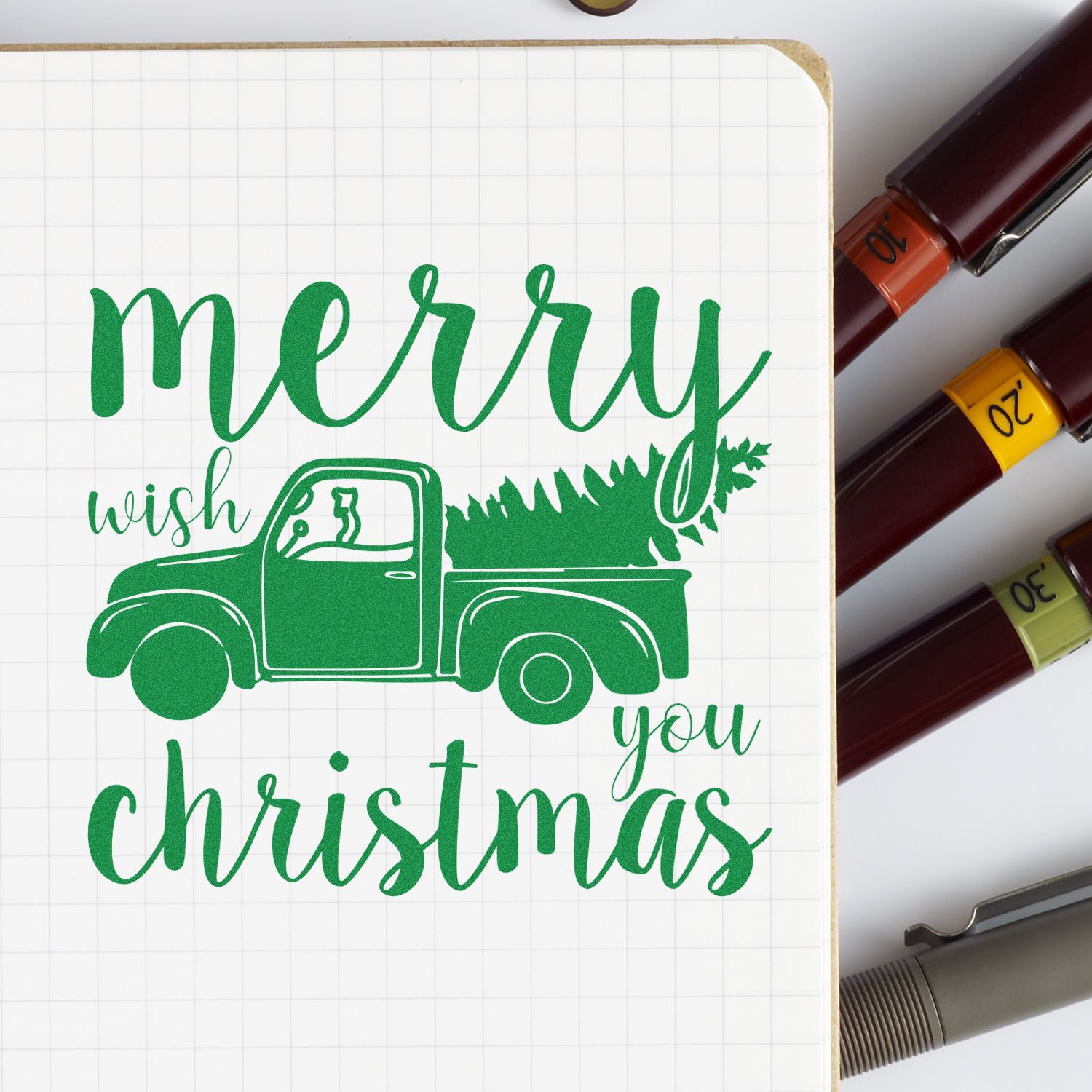 Merry Christmas rubber stamp design with vintage truck and tree, perfect for holiday cards, scrapbooking, and festive crafts.