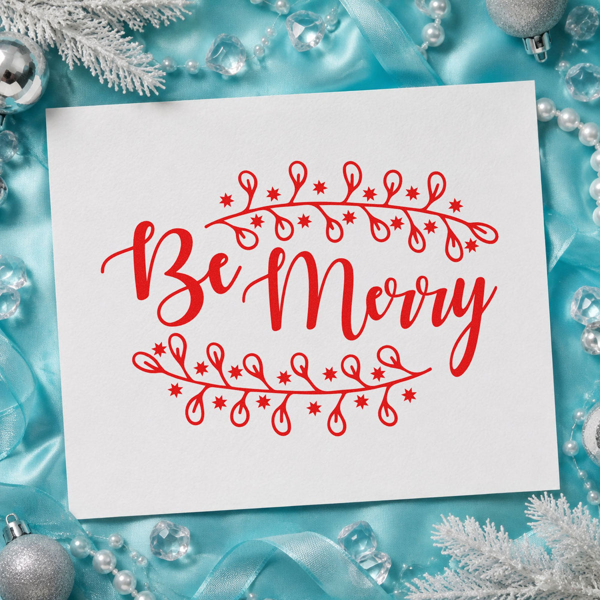 Be Merry Botanical Border craft stamp in red ink on cardstock, an easy option for apron bib printing.