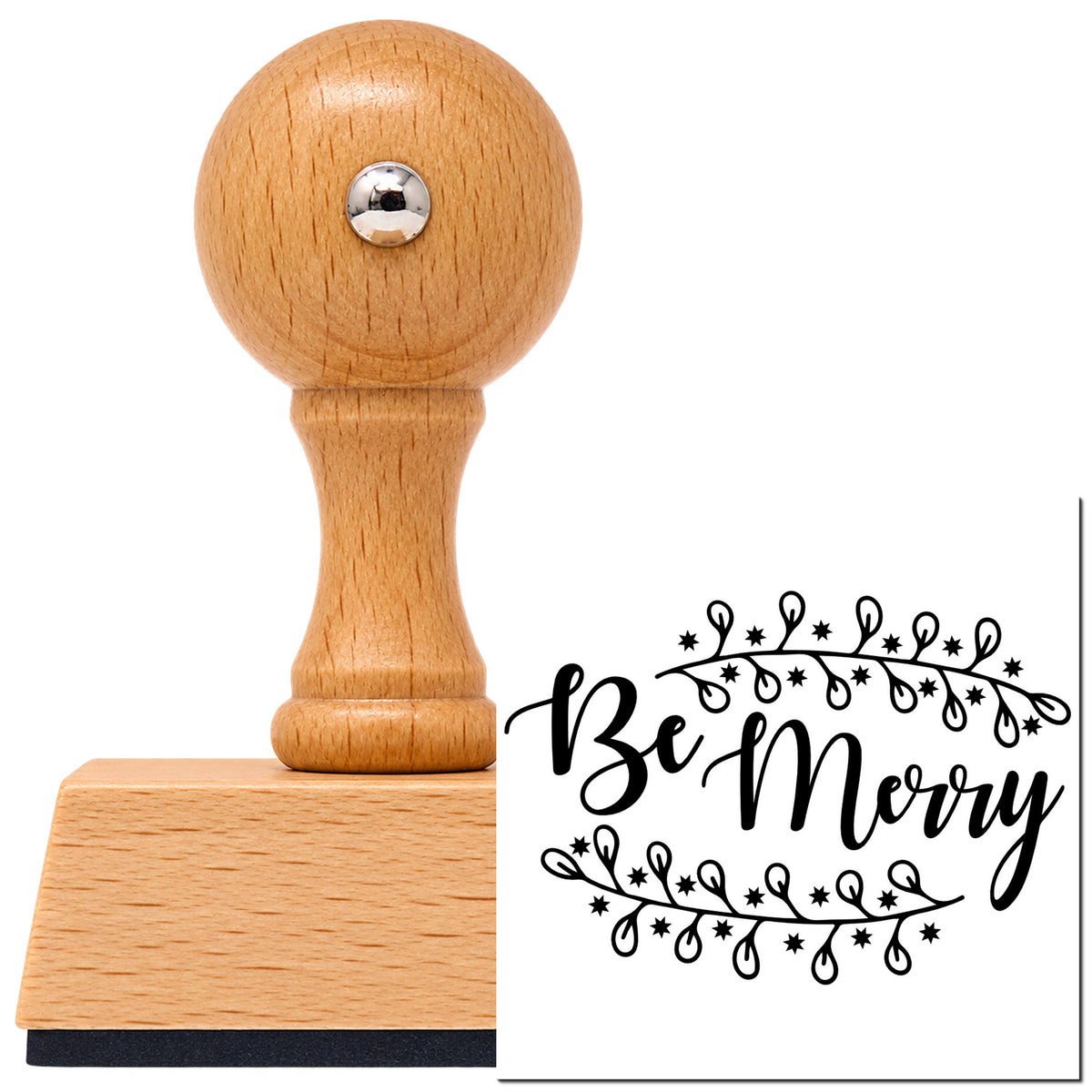 Be Merry Botanical Border Vintage Pro rubber stamp in European beech wood with a round knob handle, shown beside its black imprint.