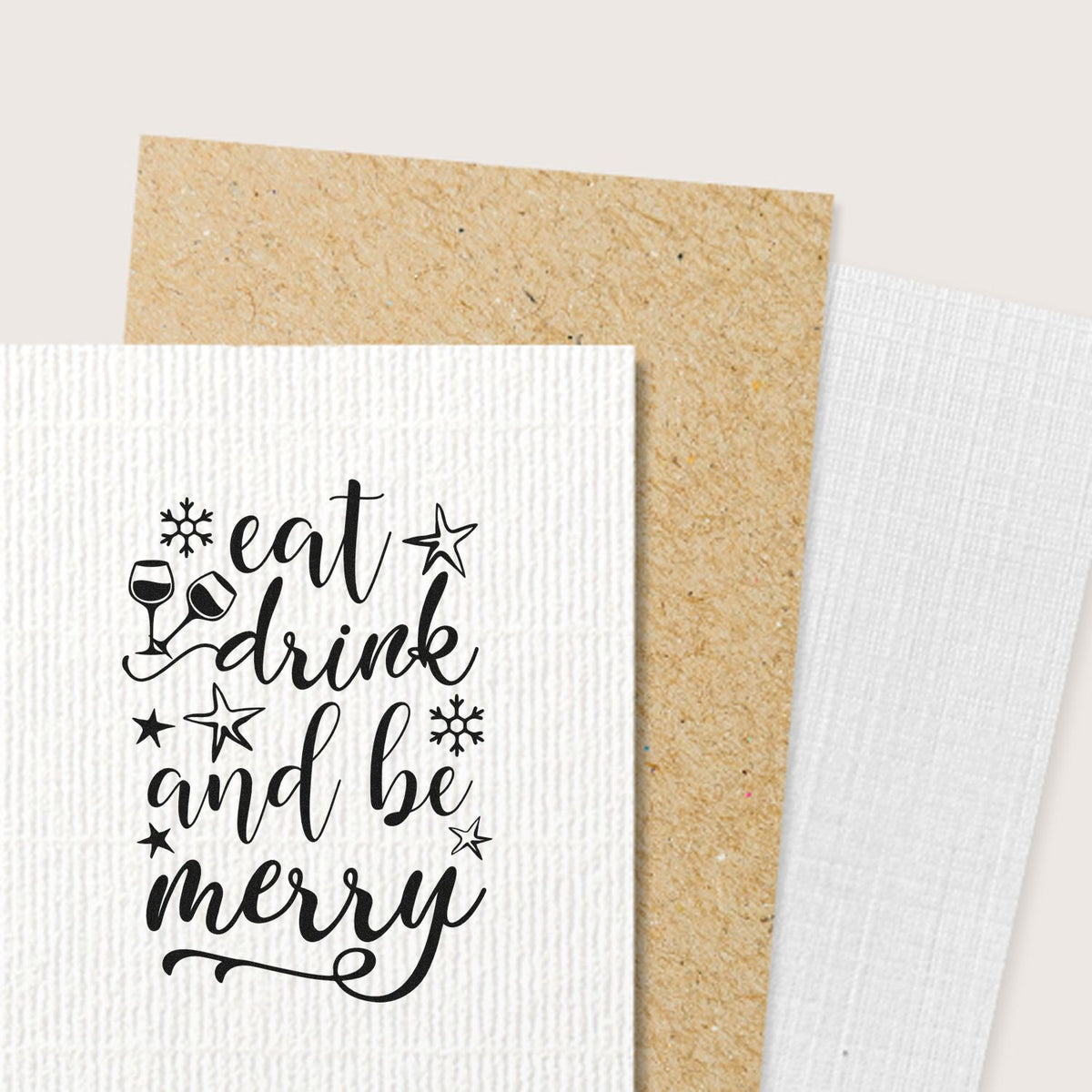 Eat Drink And Be Merry Snowflakes Premium Wooden Stamp - Vintage Pro imprint stamped in black ink. "Eat Drink and Be Merry" features clinking glasses, stars, and snowflakes.