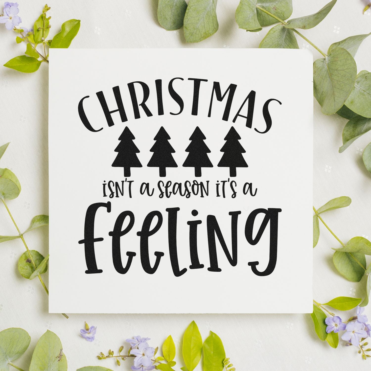Christmas isnt a season its a feeling rubber stamp design with pine trees for holiday cards, scrapbooking, and crafts.