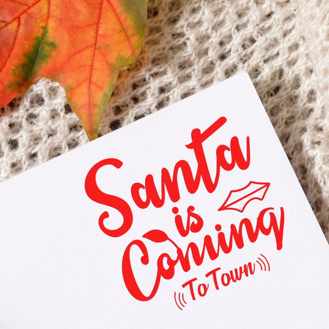 Santa is Coming to Town Christmas rubber stamp design in red on white paper, styled for holiday crafts.