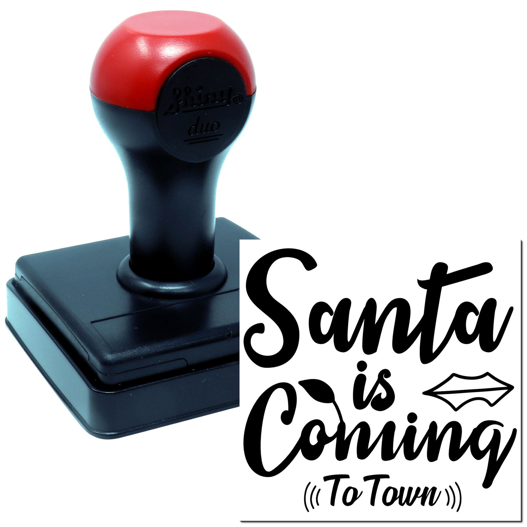 Self-inking rubber stamp with Santa is Coming to Town holiday design for Christmas cards and festive packaging.