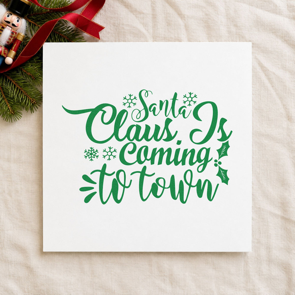 Santa Claus Coming To Town craft stamp imprint in green ink on a handmade project, one idea being arrival time placards.