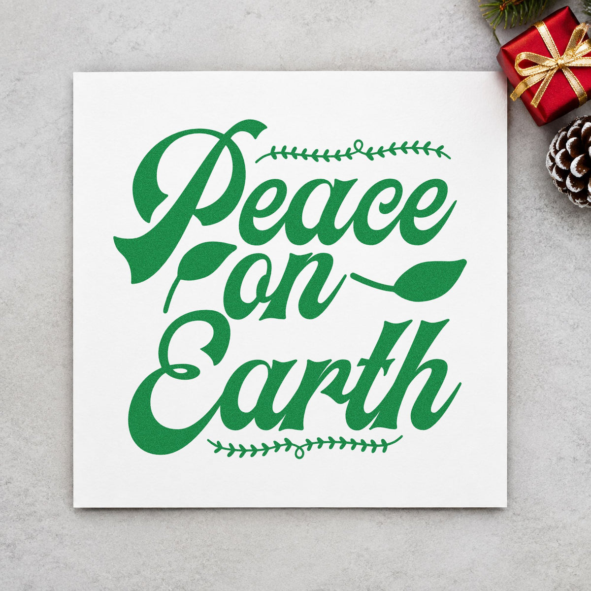 Peace On Earth Leaf Borders craft stamp imprinted in green ink on paper, a design suited to framed double mat.