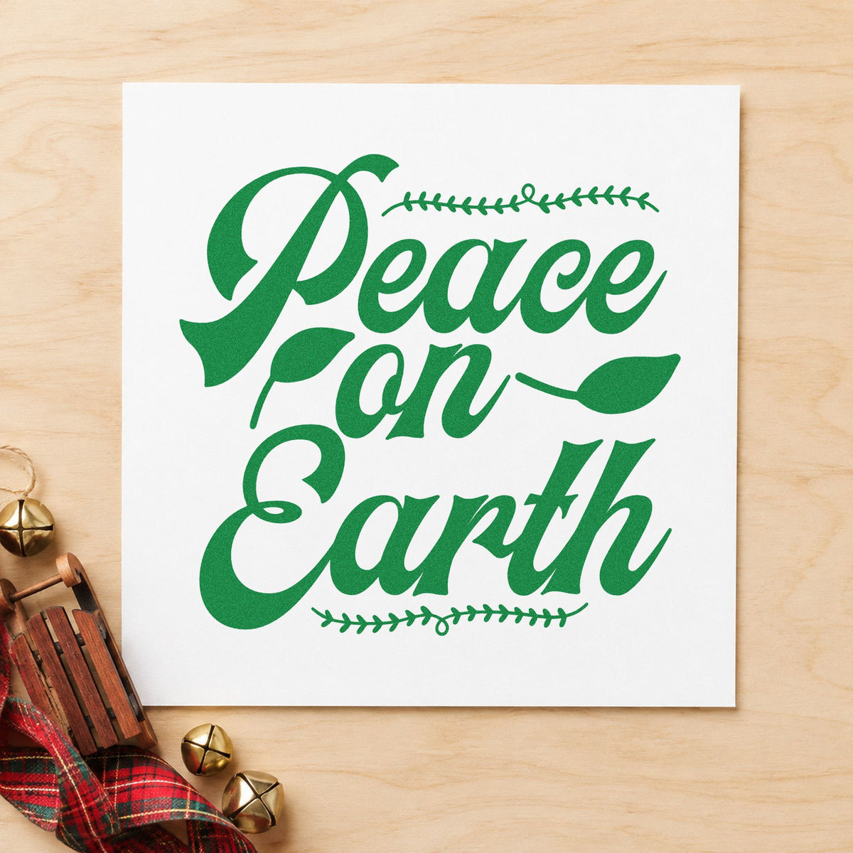 Peace On Earth Leaf Borders craft stamp imprint in green ink on a handmade project, one idea being menu panel bands.