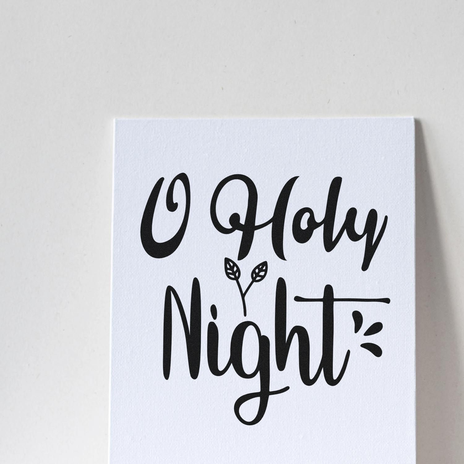 O Holy Night Christmas rubber stamp with elegant script lettering and leaf accent on white card.