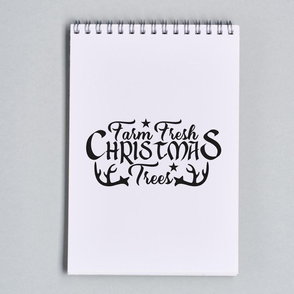 Farm Fresh Christmas Trees Antlers With Stars Premium Wooden Stamp - Vintage Pro imprint stamped in black ink. "Farm Fresh Christmas Trees" is framed by antlers with small star accents.