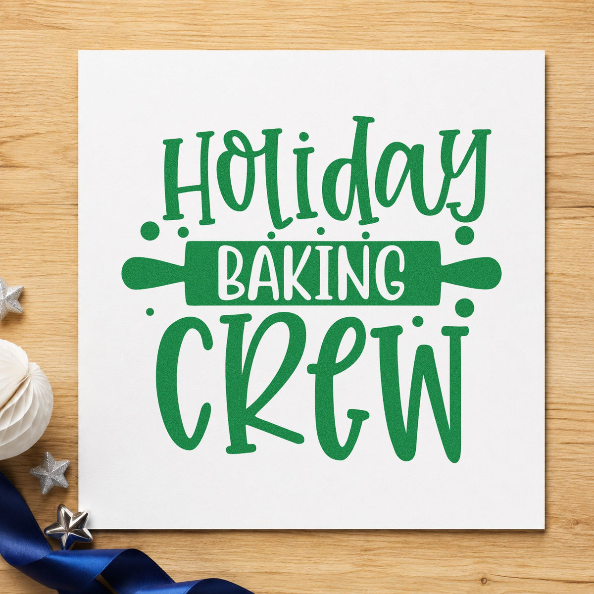 Holiday Baking Crew Rolling Pin craft stamp imprinted in green ink on paper, a design suited to framed prep counter.