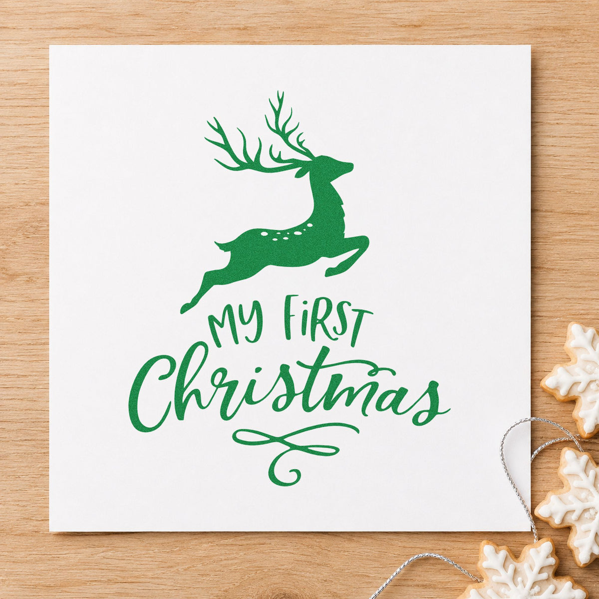 My First Christmas Reindeer craft stamp imprint in green ink on a handmade project, one idea being plush toy gift tags.